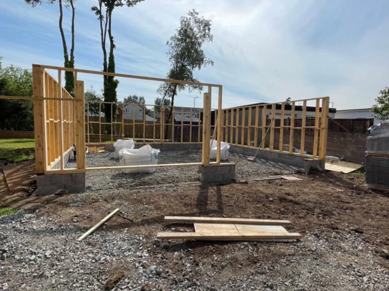 Work in progress timber frame of double garage being constructed by MacQueen Property Solution.
