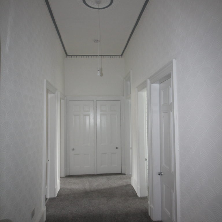 Renovated hallway with original period features.